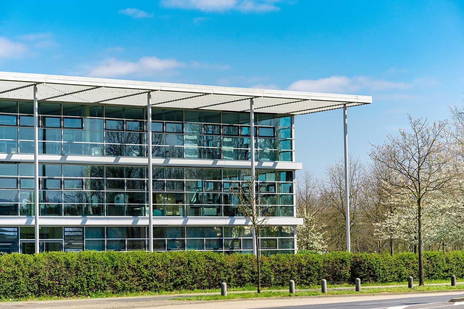 glass office building. green city.